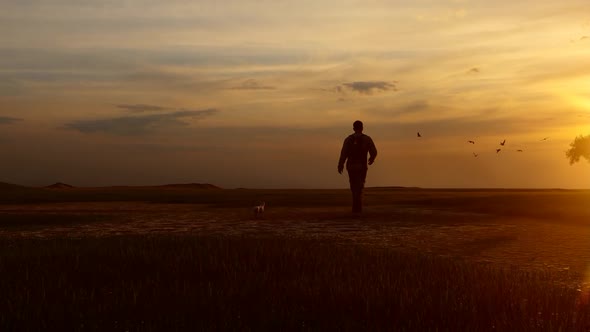 Young Camper Walking in Empty Field at Sunset