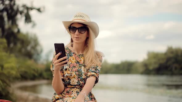 Girl Talking On Cellphone Or Smartphone. Woman In Sunglasses Using Mobile Phone And Call.