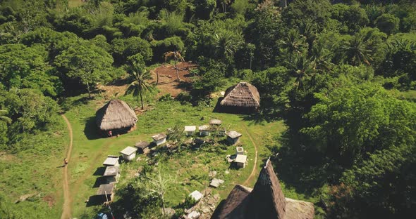 Traditional Houses of Indonesia Village at Tropical Green Landscape Aerial View