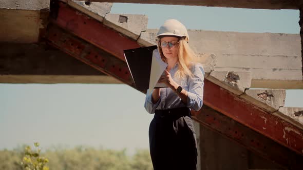 Woman Architector Inspecting Building.Female Civil Engineer On Building Constructor.Building Project