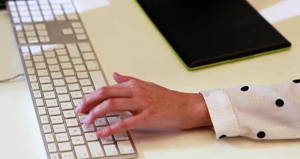 Businesswoman using graphic tablet