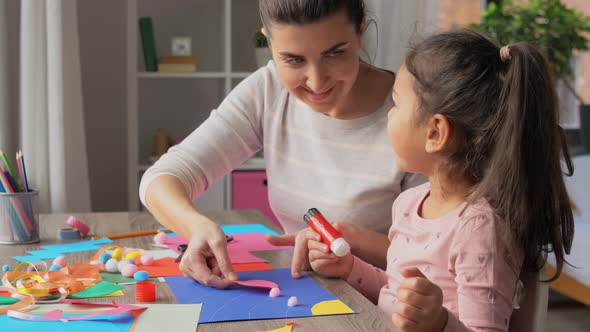 Daughter with Mother Making Applique at Home