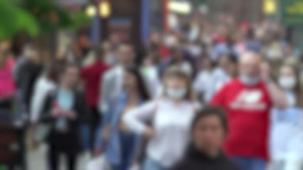 Silhouettes of People Walking in a Crowd