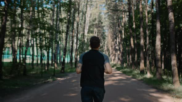 Young Handsome Man Train for Marathon Run in Park