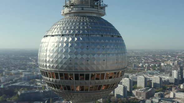 AERIAL: Super Close Up View Circle Around the Alexanderplatz TV Tower in Berlin, Germany