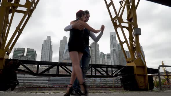 Low angle shot of professional tango dancers performing in Puerto Madero