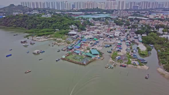 A dynamic ascending aerial footage of the fishing village in Lau Fau Shan in the New Territories of