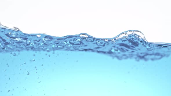 Super Slow Motion Shot of Clear Waving Water With Bubbles Background at 1000 Fps