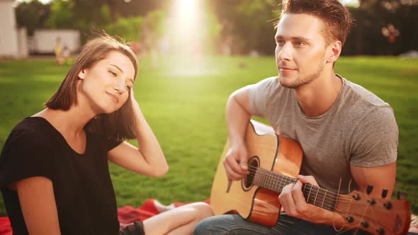 Young Beautiful Couple Smiling Resting in Park