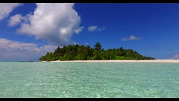 Aerial flying over sky of exotic coastline beach vacation by blue water with white sandy background 