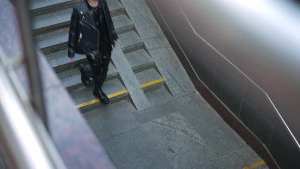 High Angle View Underground Crossing Entrance with Confident Young Gay Man Passing