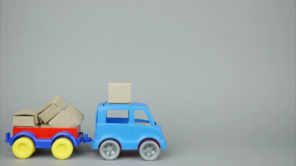 A Large Stack of Parcels. A Delivery Vehicle Arrives, Loads Parcels and Leaves. Stop Motion