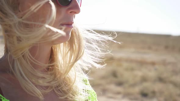 Closeup Portrait of a Young Woman Enjoying a Sunny Day