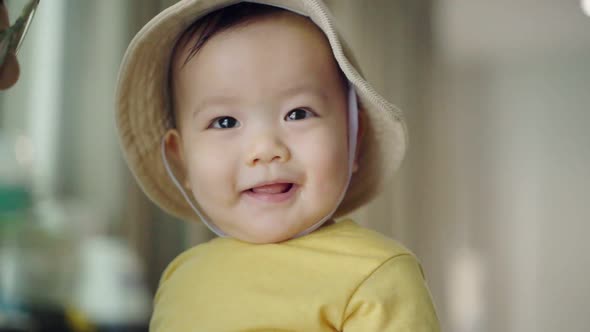 Asian baby boy playing with his mother.	