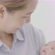 Happy Asian mother hugging her newborn baby daughter at home, Happiness moment of Asian family. - VideoHive Item for Sale