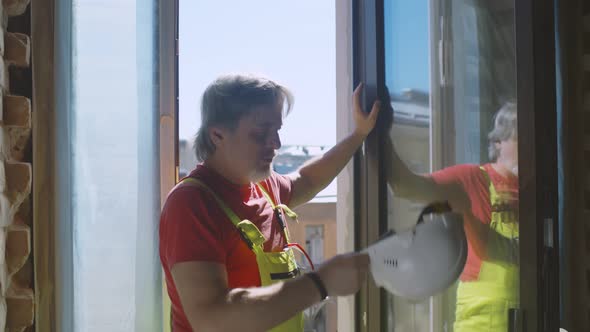 Construction Worker Relaxing Enjoying Fresh Air During Work