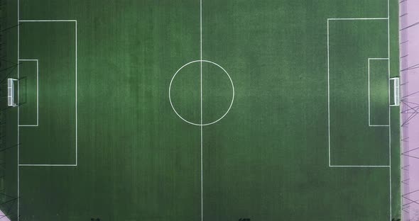 Aerial view of green football, soccer pitch. Top down view on a green, empty soccer field