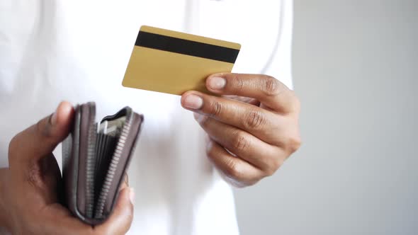 Man Hand Taking Credit Card Out From a Wallet