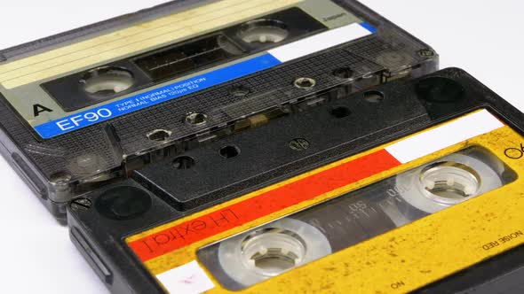 Two Vintage Audio Cassette Rotates on White Background