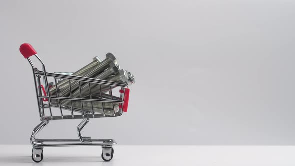Many Iron Bolts are Placed in a Small Grocery Cart