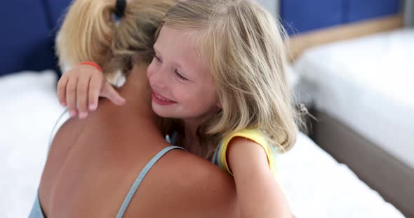 Little Girl Hugging Mother at Home  Movie