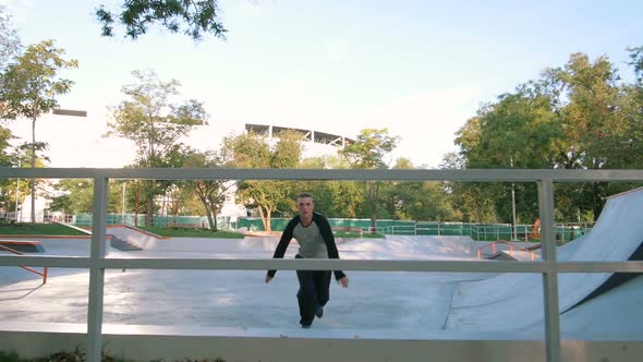 Young Man Doing Parkour Tricks in Extreme Sports Park