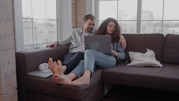 Children Make Paper Boats and Draw on the Floor Their Parents Sit on the Couch