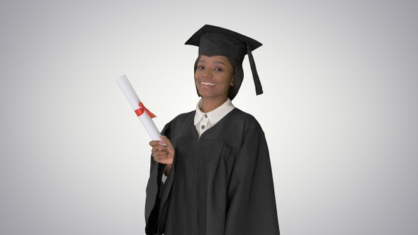 Beautiful student smiling while in her graduation cap and