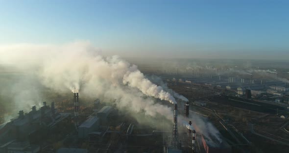Aerial Veiw Of High Smokestack With Smoke Emission. Plant Pipes Pollute Atmosphere 