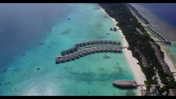 Aerial drone shot scenery of tropical lagoon beach journey by aqua blue lagoon and clean sand backgr