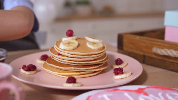 Closeup Pancake Heap Decorating By Child's Hand