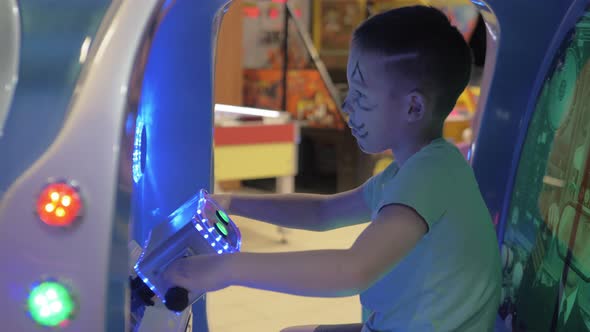Boy Having Fun with Sea-battle Arcade