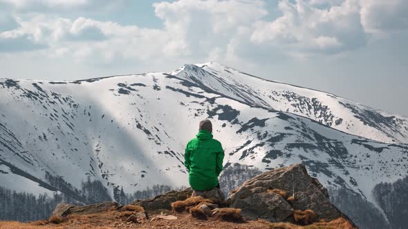 Man Sit on Rock in Spring Mountains