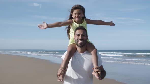 Happy Excited Little Girl Riding on Dads Neck