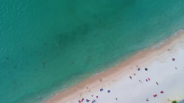 High quality footage.Colorful Sea beach beautiful waves Foaming and Splashing on the beach sand