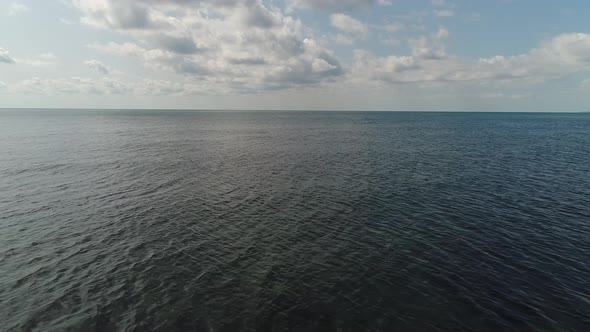 Dark Cold Sea or Ocean, Beautiful Sky. Marine Background Aerial View