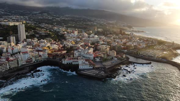 Puerto de la Cruz, city in Tenerife, Canary Islands, Spain at sunset, drone shot