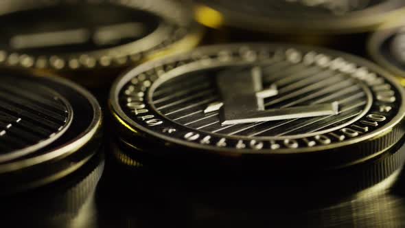 Rotating shot of Bitcoins (digital cryptocurrency) - BITCOIN LITECOIN