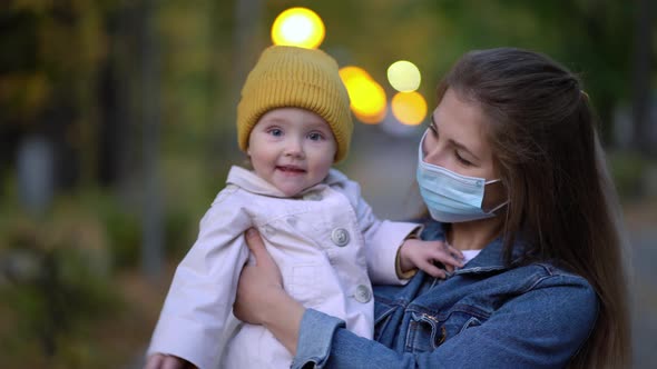 Masked Mother Holds Hand Lovely Daughter on Street Walk During Second Wave Quarantine Coronavirus