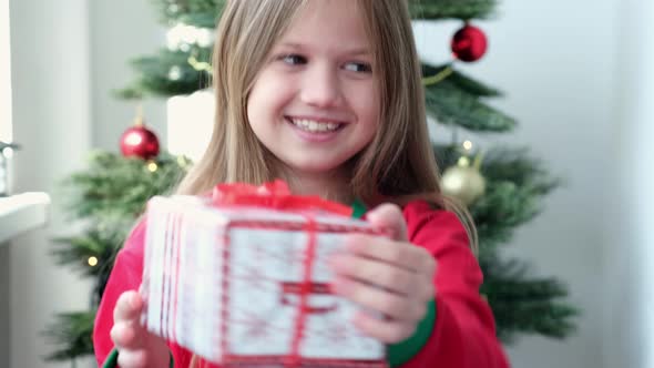 Little Girl Happy with Christmas Gift From Santa on Christmas Morning