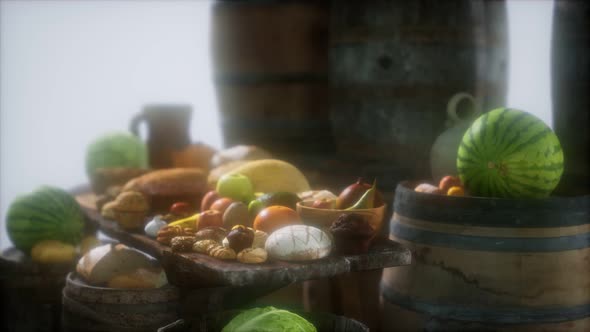 Food Table with Wine Barrels and Some Fruits Vegetables and Bread alt
