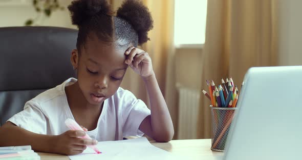 Serious Focused Little Girl African American Child Watching Video Drawing Lesson on Online Teacher