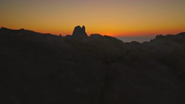 Es Vedra Ibiza's natural beauty gimbal hero reveal shot, after sunset