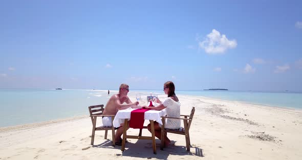 Romantic people after marriage in love have fun on beach on white sand background 4K