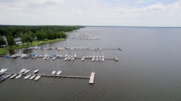 Drone footage of sailboats in harbors at Mardorf, Steinhuder Meer lake.