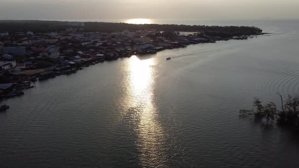 Sunset view boat and village