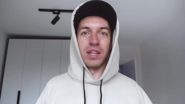 POV of Handsome Young Man Making Video Call From Home Waving Hand Talking Enjoying Communication