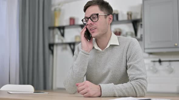 Young Man Talking on Phone, Negotiation