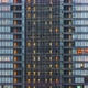 Time lapse of elevator moving and people working, office window view on business center facade - VideoHive Item for Sale