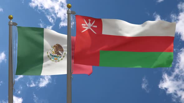Mexico Flag Vs Oman Flag On Flagpole